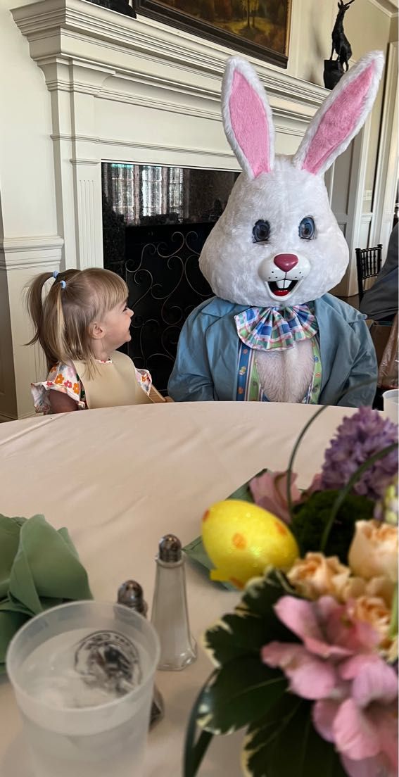 a toddler and the easter bunny at brunch